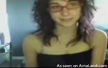 Chick with glasses fondling her tits on webcam